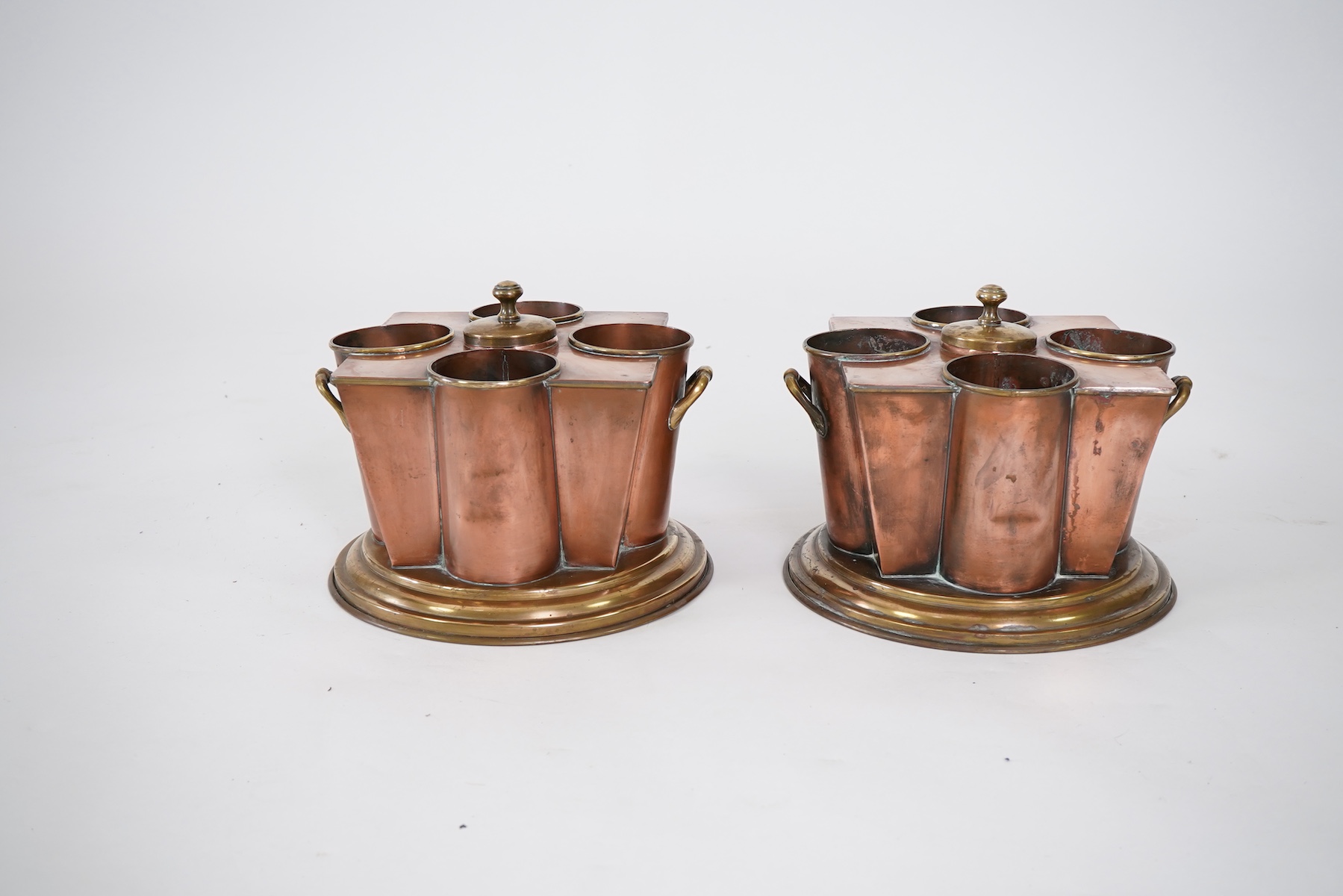 A pair of Art Deco copper and brass champagne/wine coolers, from the passenger ship SS Boston (1924-1942)